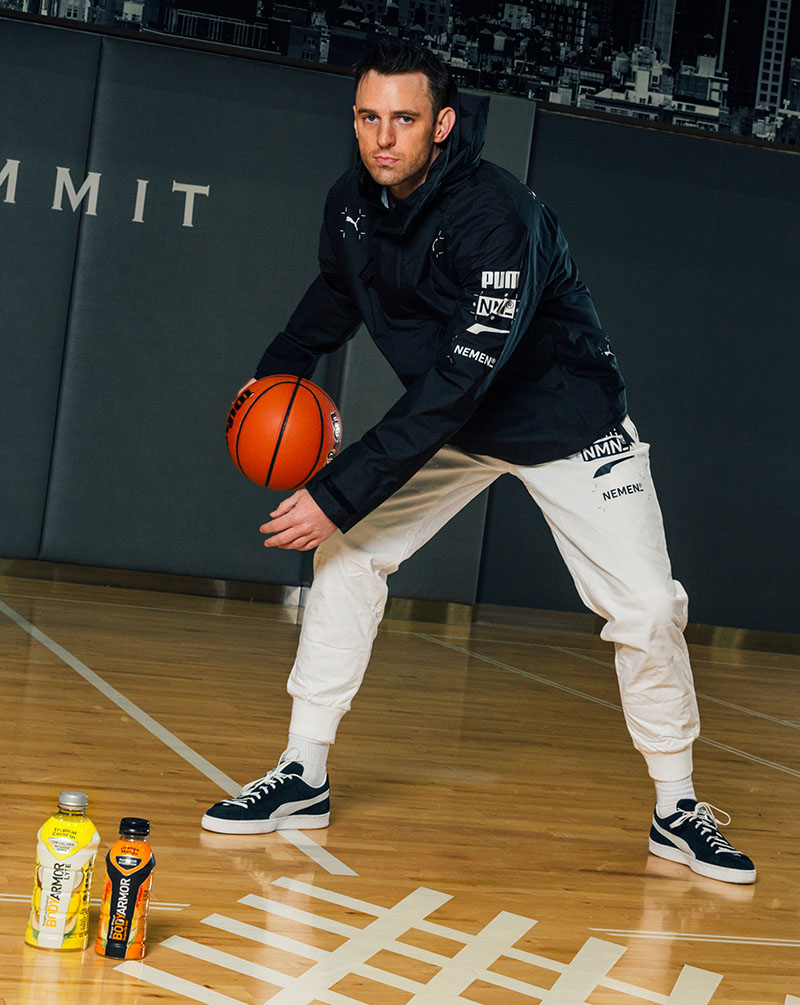 Chris Brickley Chris Brickley dribbling a basketball next to two bottles of BODYARMOR